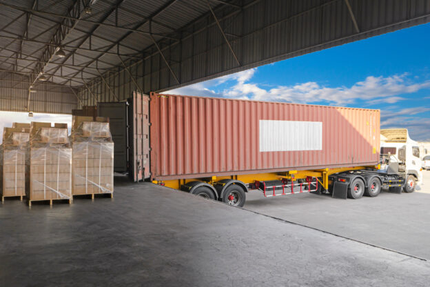Semi truck being loaded at a freight factoring company.