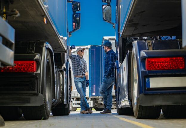 two trucking professionals talking about truck load pay and how different hauls impact it.