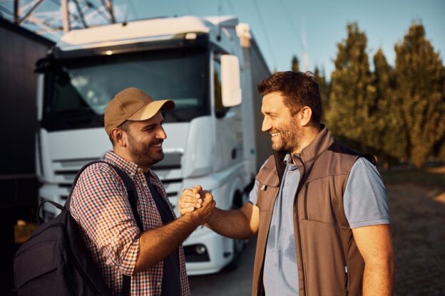 Two people expanding their trucking network.
